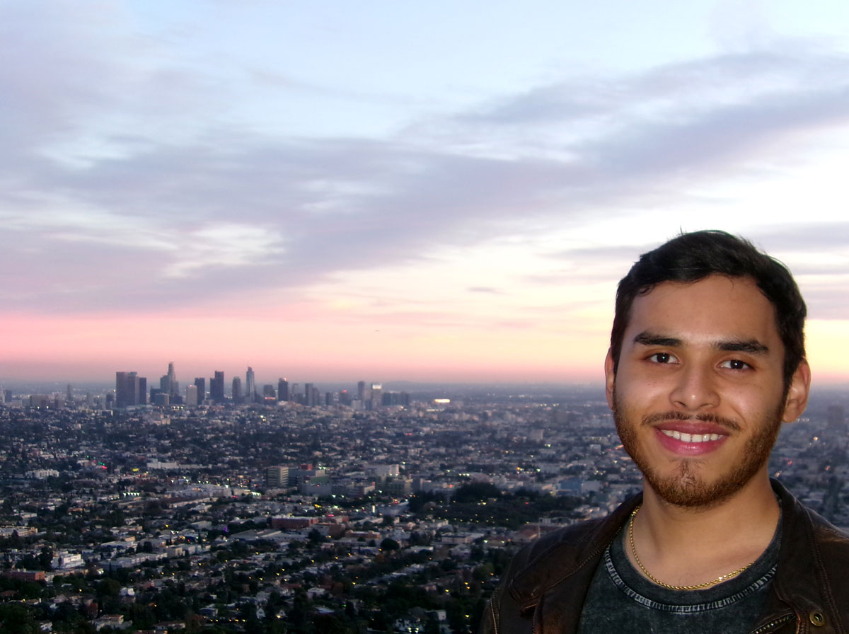 Jonathan Donis with a Los Angeles skyline in the background