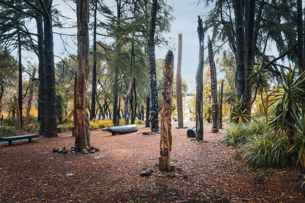 Carved wooden poles in the garden.
