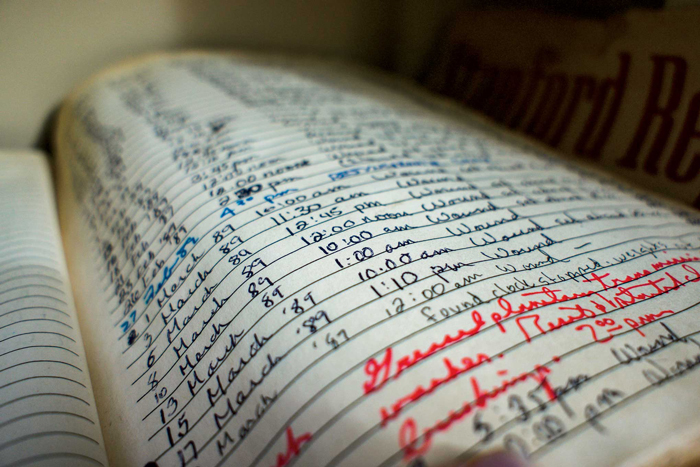 Photo of slightly yellowed log page, including handwritten entries.