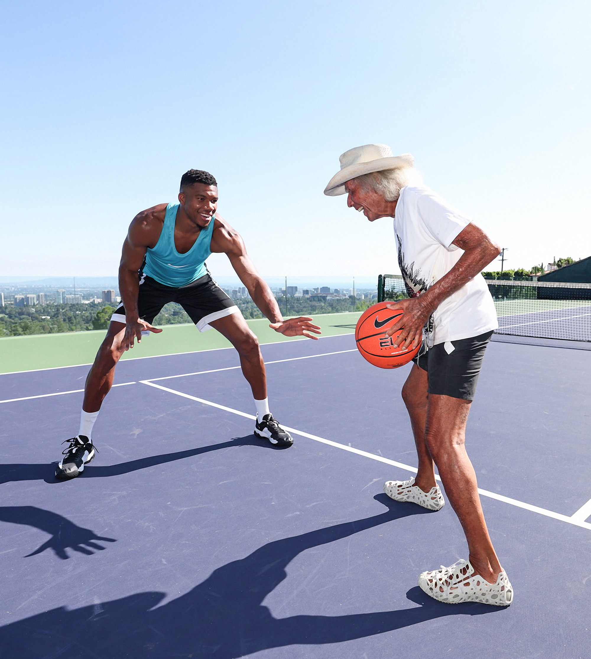 James Goldstein playing basketball with Giannis Antetokounmpo 