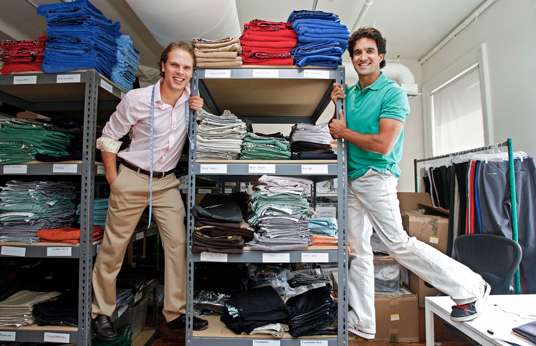Spaly and Dunn among racks of pants.