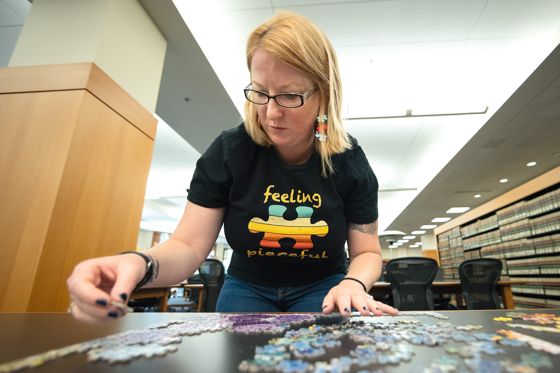 Taylor putting together a puzzle