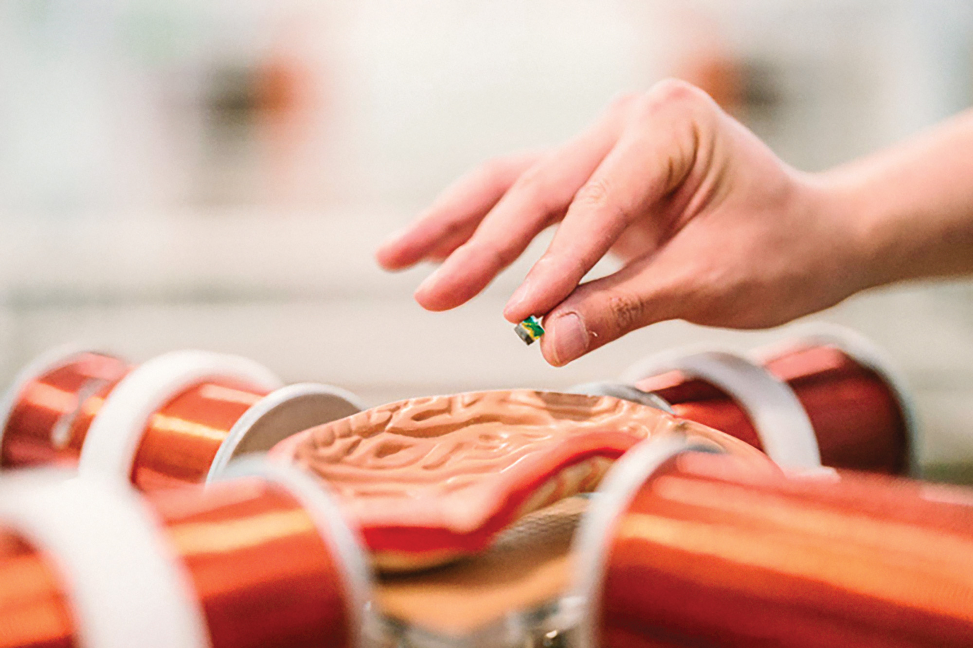 Hand holding a millispinner over a model