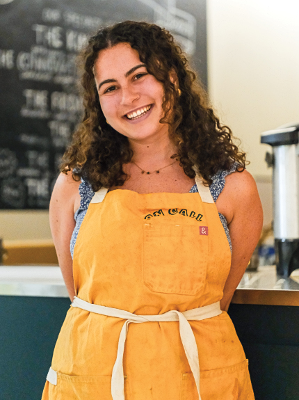 Portrait of Peyton Klein in an apron at the cafe